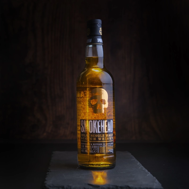 Product shot of a bottle of Smokhead whisky on dark background