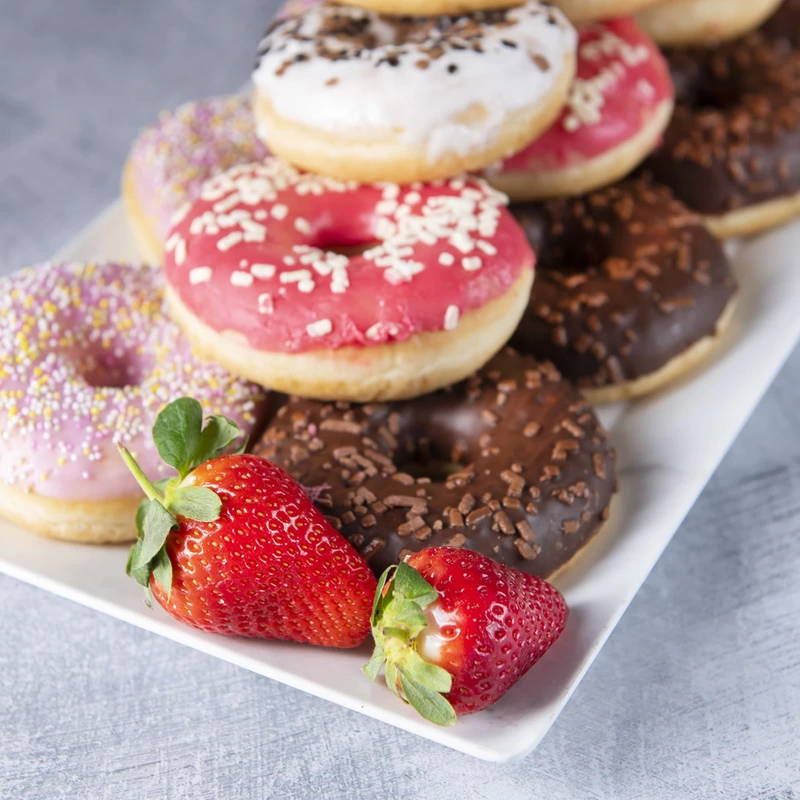 Iced donuts with fresh strawberries