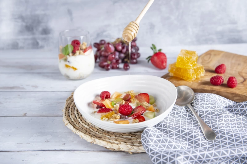 A breakfast bowl with fresh fruit and muesli